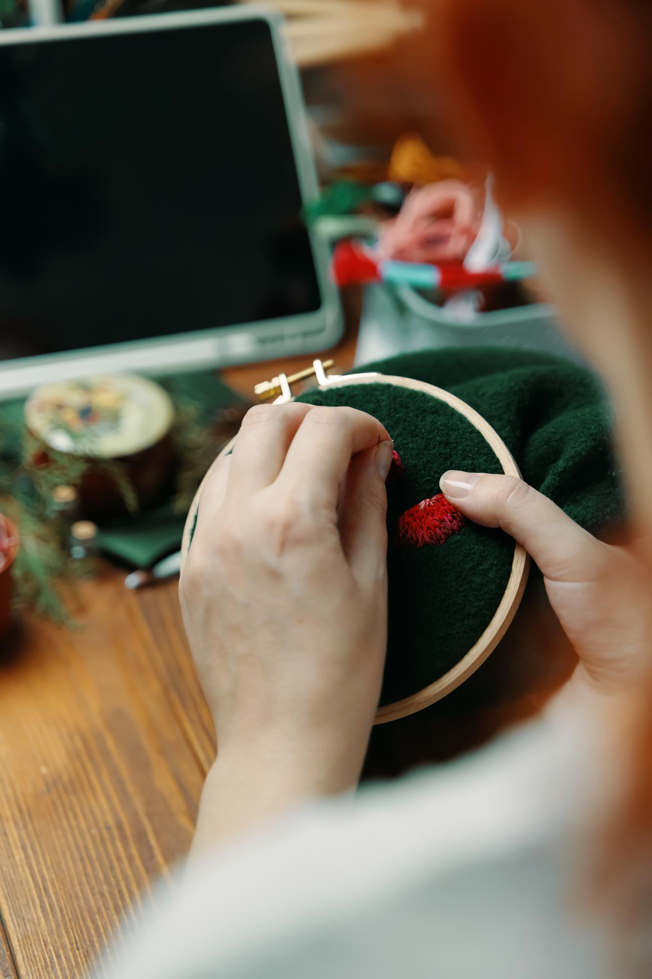 artisan stitching at work in studio